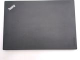a laptop that is sitting on a white surface