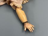 a doll that is laying down on the floor