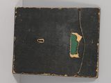 a black box with a green patch on it