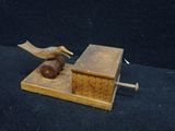 a bird that is sitting on top of a piece of wood