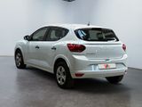 the rear end of a white car parked in a white room