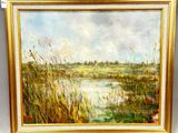 un tableau représentant un paysage avec de l'herbe et de l'eau, dans un cadre doré