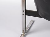 a black leather chair with a metal frame on a white background