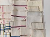 several pieces of cloth are laid out on a white surface