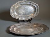 pair of antique silver plate on stand on grey background