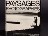 the book cover of paysages photographies, with a man standing on a boat