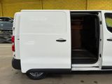 a white van with its doors open in a parking lot