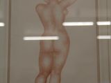 a picture of a drawing of a nude woman in a white frame