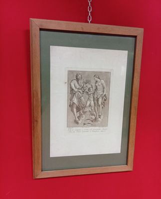 tableau accroché au mur d'une salle de bains équipée de toilettes et d'un lavabo