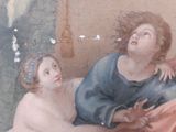 a painting of a woman sitting on a bed next to a naked man