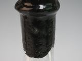 a close up of a bottle of liquor on a table