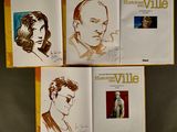 three books with drawings of a man and a woman on them