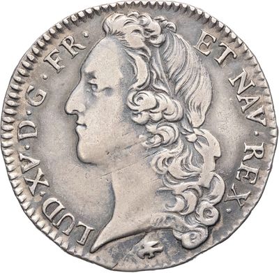 gros plan d'une pièce de monnaie sur laquelle figure un visage de femme