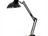 an image of a black desk lamp on a white background