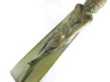 bronze sculpture of a woman holding a flower in her right hand