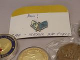 some coins are sitting on a table with a note attached to them