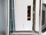 a white microwave sitting inside of a box on a table