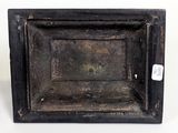 a small wooden box that has a tag on it