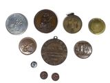 a lot of coins that are on a white surface