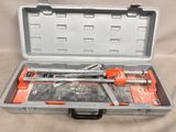 a tool in a case with a wrenet and a hammer in it