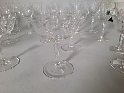 many wine glasses lined up on a table