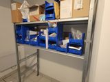 a room with shelves and bins on the floor