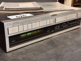 a cassette player that is sitting on top of a cd player
