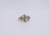 an image of a gold and diamond ring on a white background