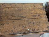 a wooden table with a drawer on it next to a table with a drawer on it