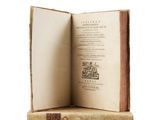 an open book with a picture of a man sitting on top of it