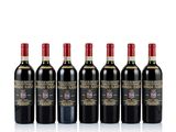 six bottles of red wine lined up in a row