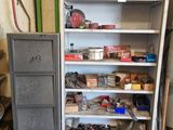 a metal cabinet with many items on it in a garage