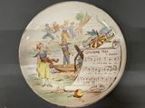 a plate with a picture of a boy and a girl on it