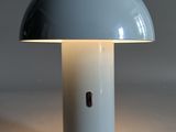 an image of a light blue table lamp with a white base