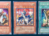 three cards with different designs are displayed on a blue background