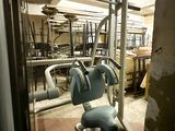 an image of a gym room with equipment in it