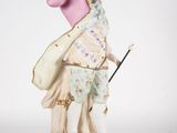 an image of a figurine of a man with a hat and a cane