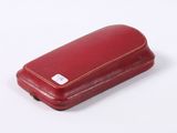 a red case that is sitting on a white surface