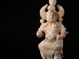an image of a statue of a man holding a sword