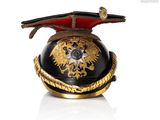 a black and gold helmet with a gold eagle on it