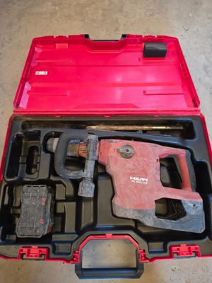 a tool kit in a red case on the floor