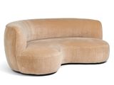 an image of a beige curved sofa with a black base