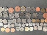 a bunch of coins sitting on top of a table next to each other