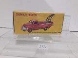 a red truck that is on display on a clear shelf