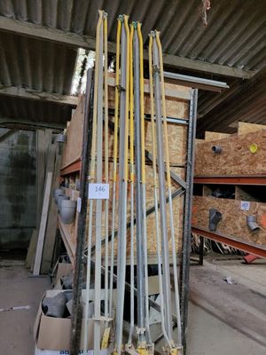 a pile of skis and ski poles in a warehouse