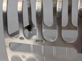 a metal rack that has four forks in it