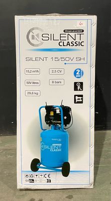 a box of silent classic air compressors on the floor