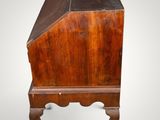 an old wooden desk with a drawer on top of it