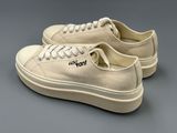 an image of a pair of white sneakers with a logo on them