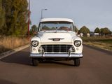a white truck that is driving down the road